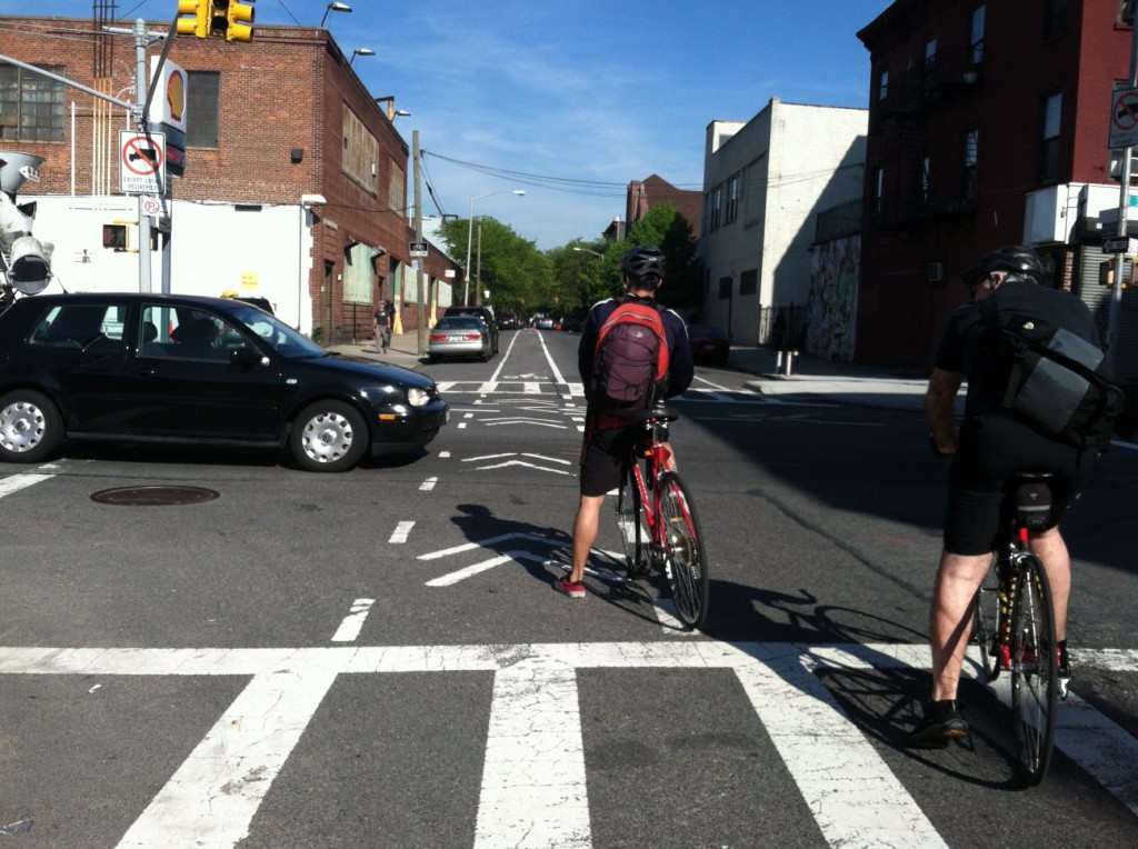 bike commuting safety, biker in intersection